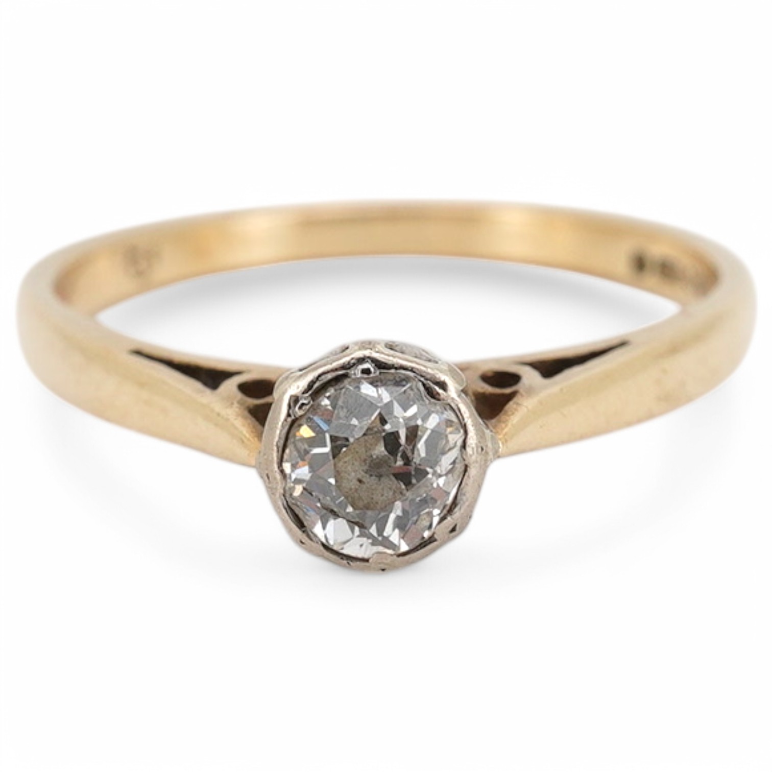 A solitaire diamond ring, collet-set with an antique circular-cut diamond weighing approximately 0.20 carats, mounted in 9ct gold, size L, British hallmarks, gross weight approximately 1.8 grams, Condition: fair